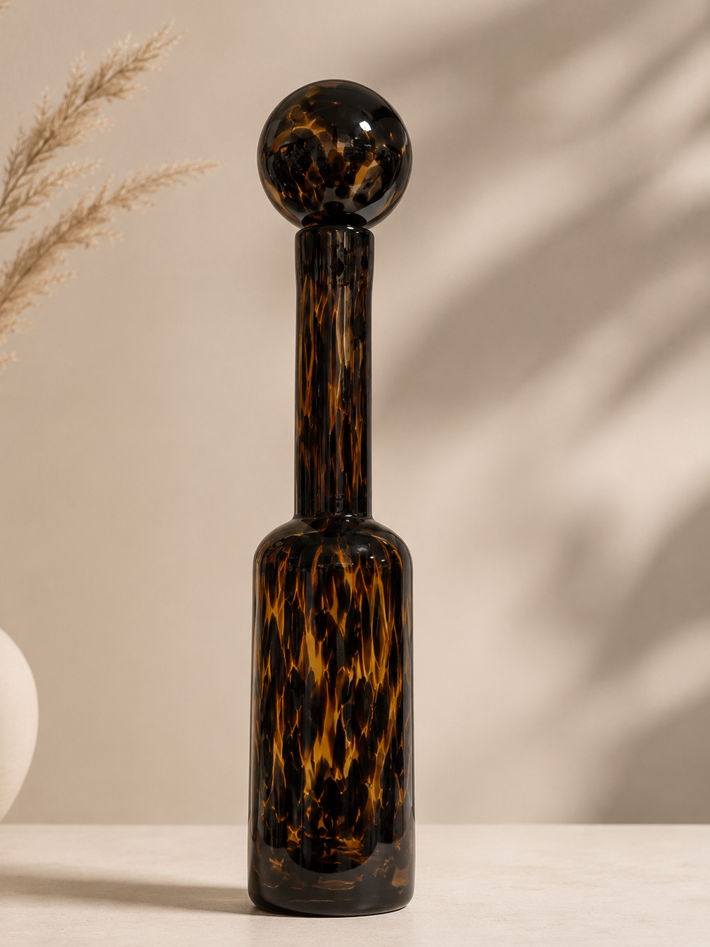 Tortoise Glass Bottle in decorative glass, part of the Nilvara selection