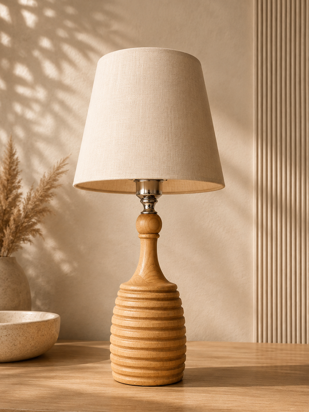 Luna Table Lamp in sculpted wood-tone base, part of the Nilvara selection
